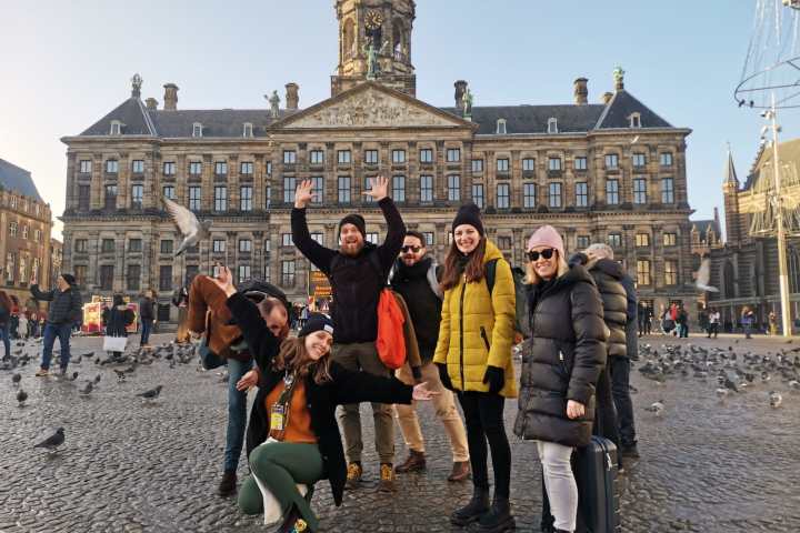 a group of people standing in front of a building