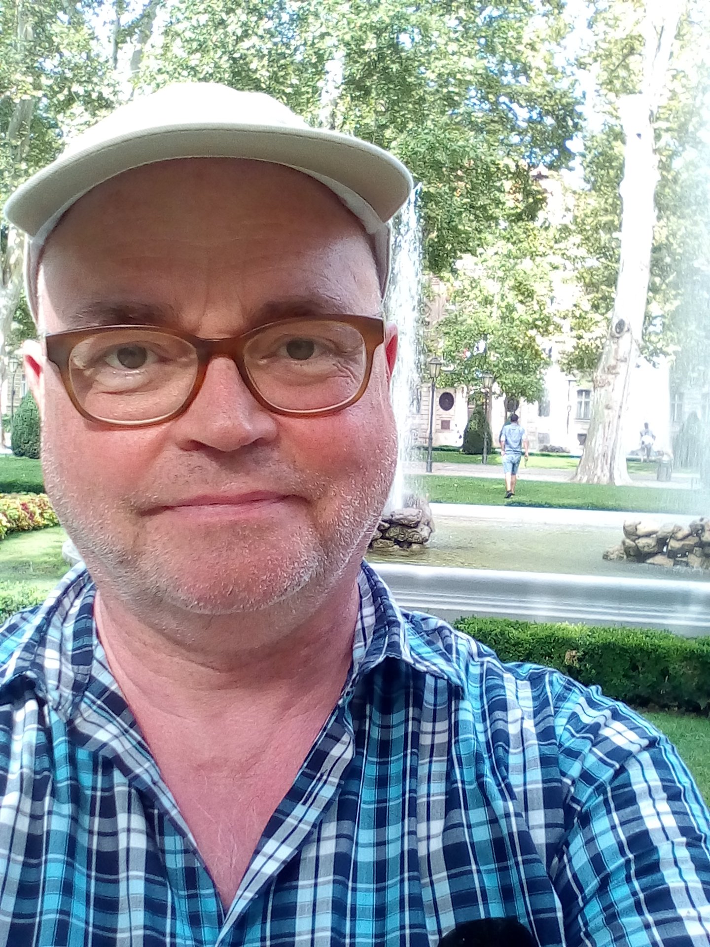 a man wearing a hat and glasses