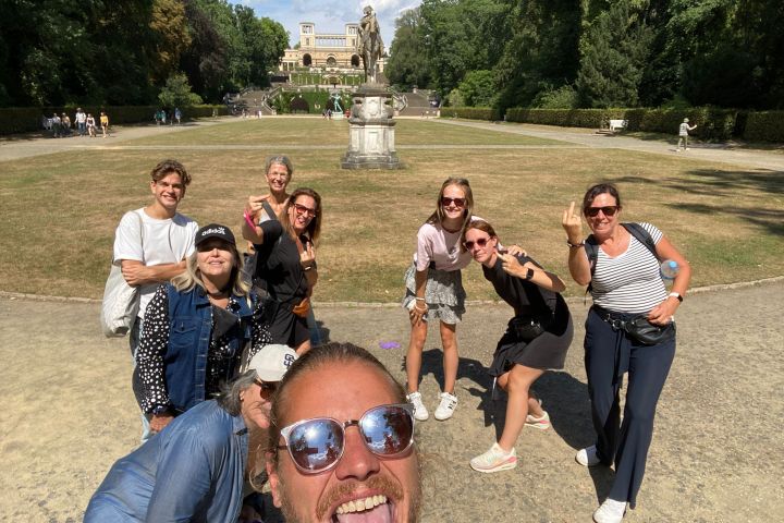 a group of people sitting at a park